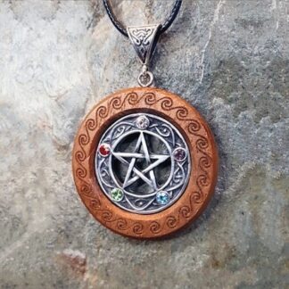 Classic Handmade Pentacle Necklace in fine pewter on Iroko with background of spirals