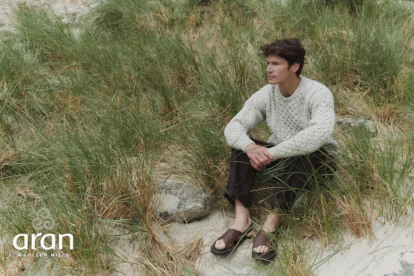 Aran Man Sitting on Beach